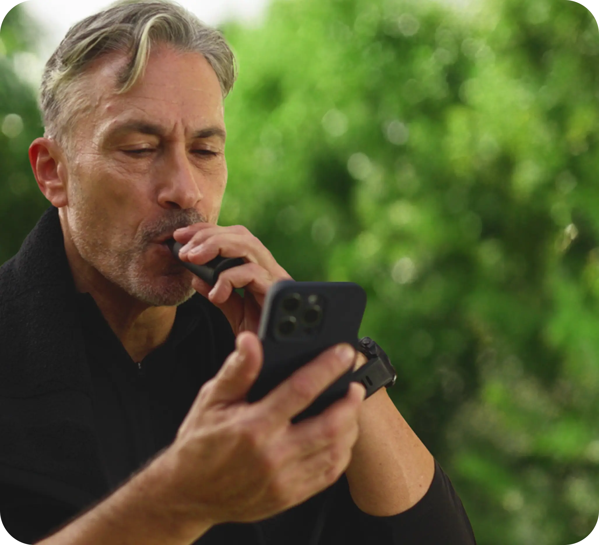 Man taking a breath with Lumen outdoors
