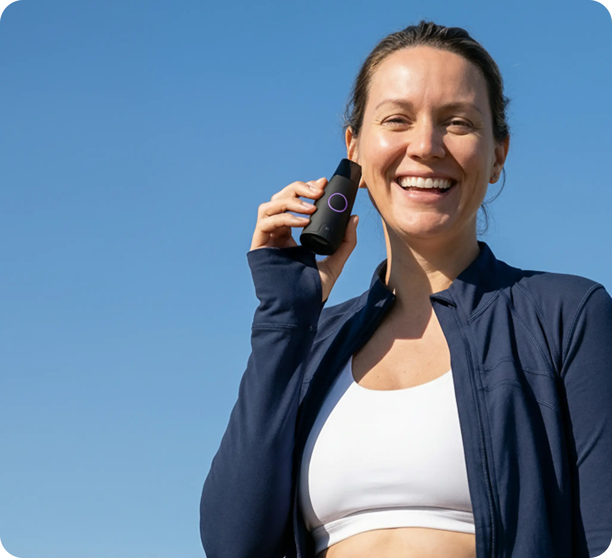 Woman smiling with Lumen after a workout